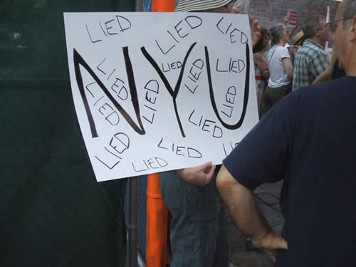 protest sign at rally against proposed NYU Dorm