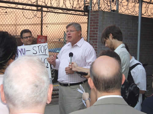 Senator Tom Duane speaks to protesters at rally against proposed NYU Dorm